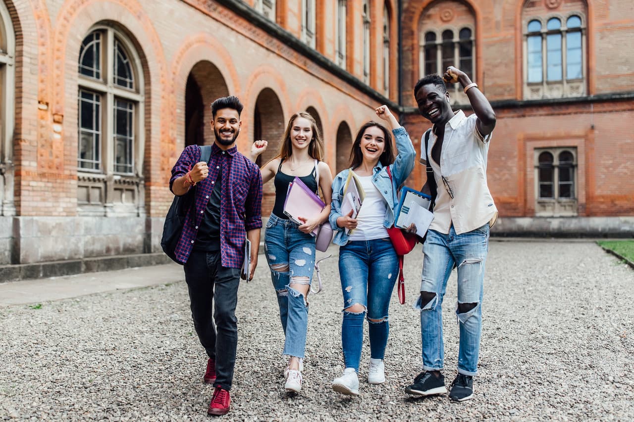 Friends smiling with happy emotions at university